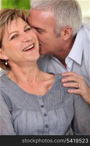 Portrait of mature couple laughing