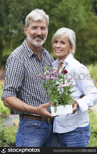 Portrait Of Mature Couple Shopping At Garden Center