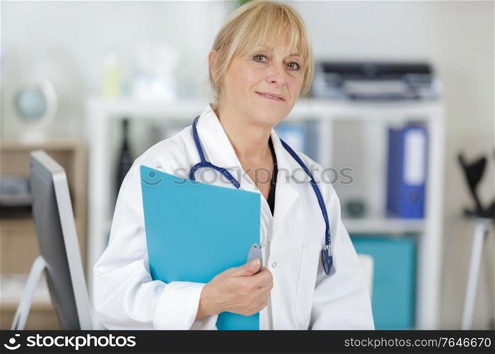 portrait of mature female doctor standing