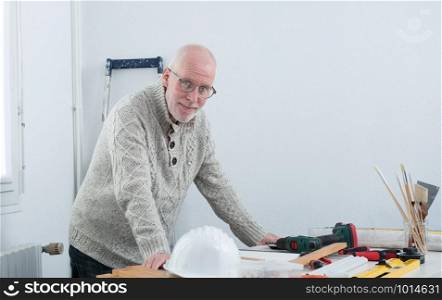 portrait of mature man doing DIY at home