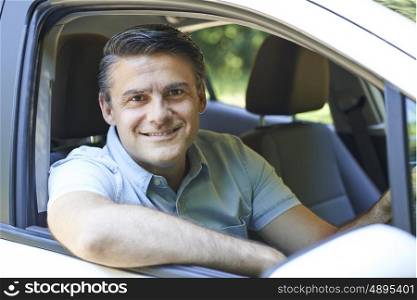 Portrait Of Mature Man Driving Car