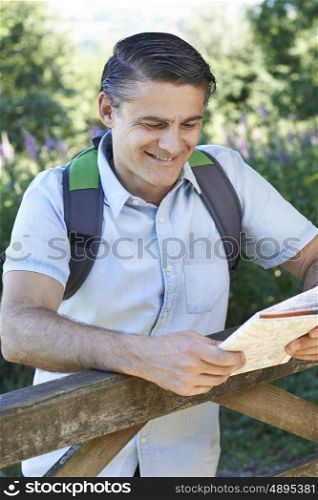 Portrait Of Mature Man Hiking In Countryside