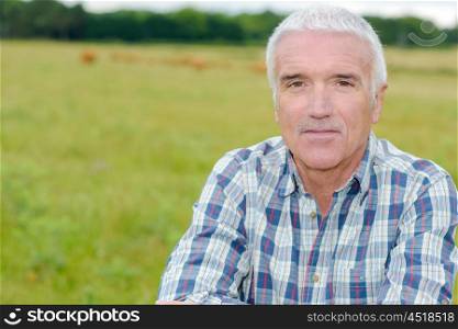 Portrait of mature man in field