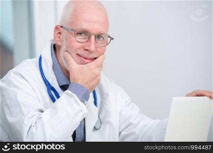 portrait of mature medical doctor with a stethoscope