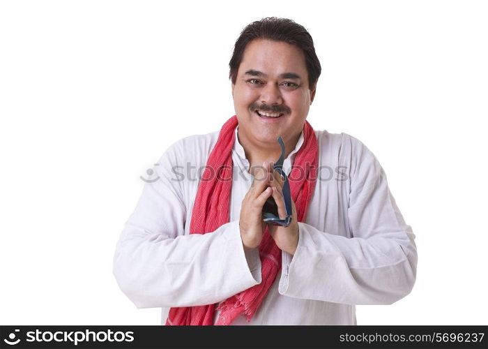 Portrait of mature politician smiling and greeting over white background