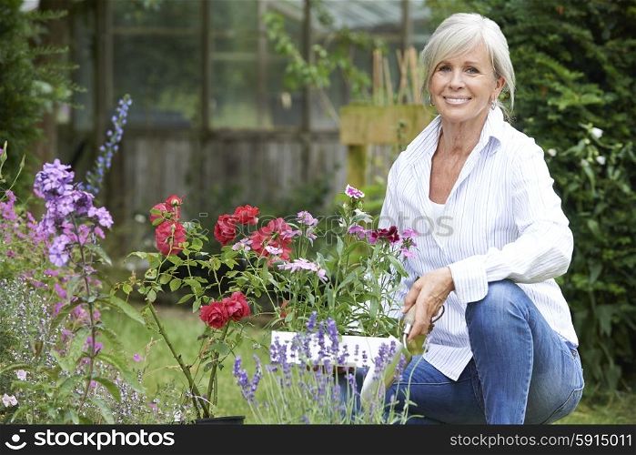 Portrait Of Mature Woman Gardening