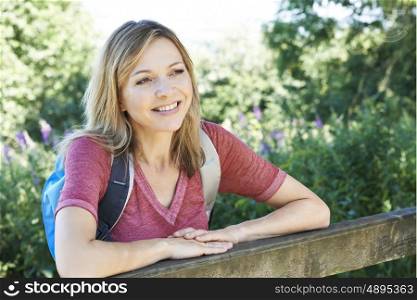 Portrait Of Mature Woman Hiking In Countryside
