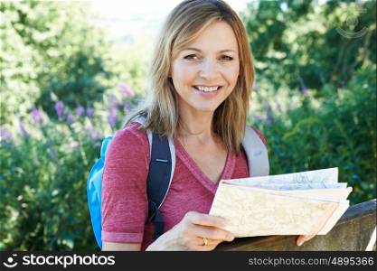 Portrait Of Mature Woman Hiking In Countryside