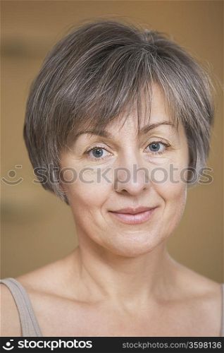 Portrait of mature woman with short grey hair