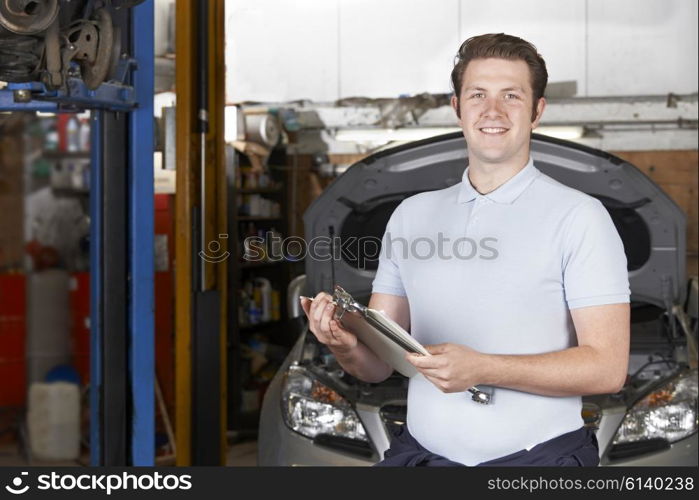 Portrait Of Mechanic In Auto Repair Shop