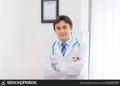 Portrait of medical doctor in cabinet