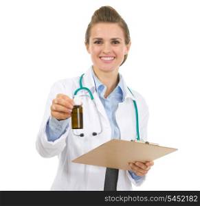 Portrait of medical doctor woman with clipboard and medecine bottle