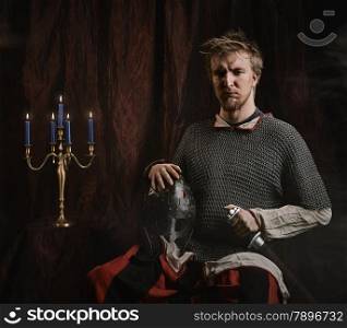 Portrait of medieval knight and he wearing a chainmail