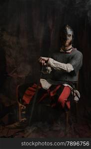 Portrait of medieval knight and he wearing a chainmail