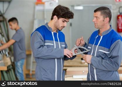portrait of men working in workshop