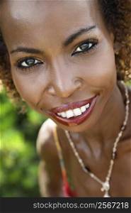 Portrait of mid-adult African American female smiling and making eye contact.