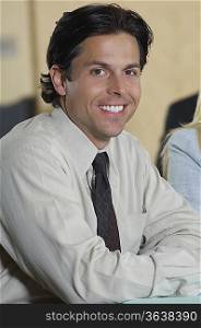 Portrait of mid adult businessman smiling