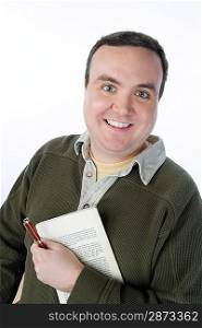Portrait of mid-adult man holding pen and book