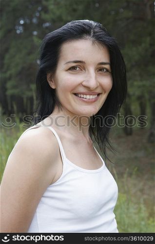 Portrait of mid-adult woman near forest