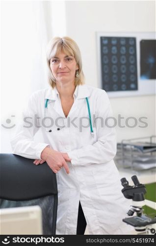 Portrait of middle age doctor woman at laboratory