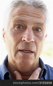 Portrait Of Middle Aged Man Looking Surprised