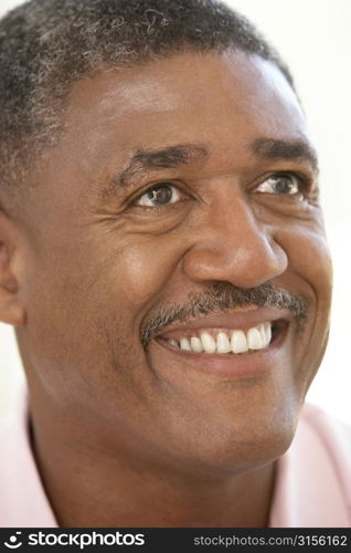 Portrait Of Middle Aged Man Smiling Happily