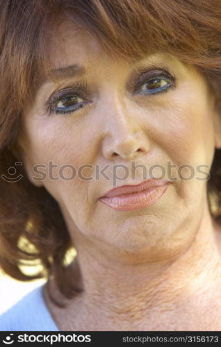 Portrait Of Middle Aged Woman Looking At Camera Anxiously