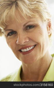 Portrait Of Middle Aged Woman Smiling At Camera