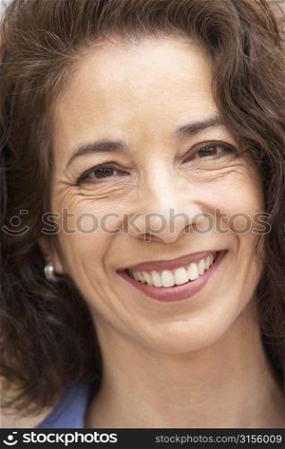 Portrait Of Middle Aged Woman Smiling At The Camera