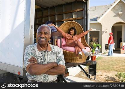 Portrait of middleaged couple, lady on lorry