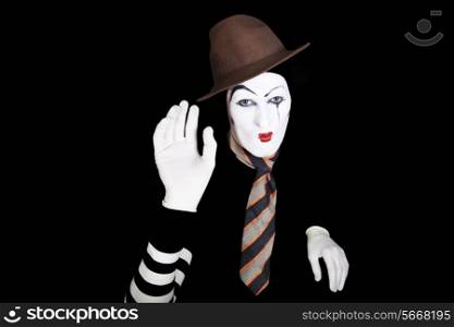 portrait of mim in white gloves on black background
