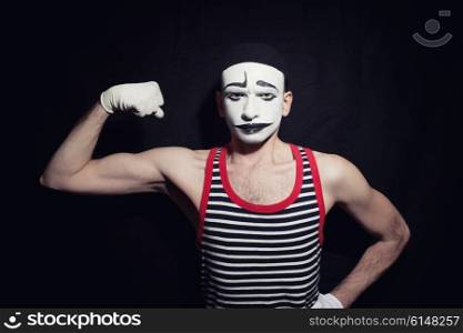 Portrait of mime actor on black background