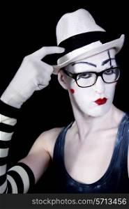Portrait of Mime in white hat glasses and gloves closeup