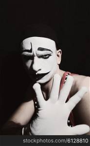 Portrait of mime on black background