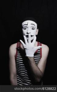 Portrait of mime on black background