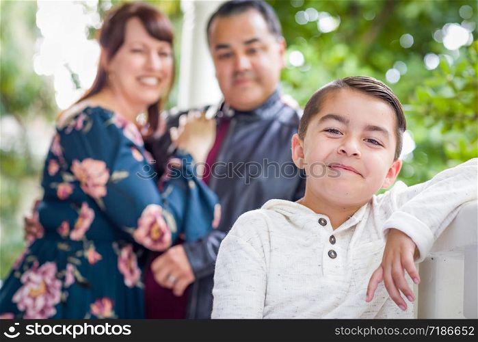 Portrait of Mixed Race Couple Standing Behind Young Son