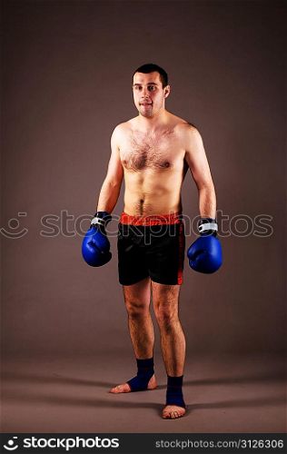 portrait of mma fighter on gray background