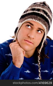 portrait of model wearing woollen cap against white background