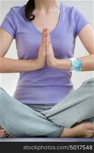 Portrait of modern healthy yoga woman wearing smart watch device with touchscreen