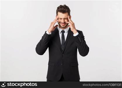 Portrait of modern serious business person in dark suit and contemplating with both hands resting at head, isolated on white background. Portrait of modern serious business person in dark suit and contemplating with both hands resting at head, isolated on white background.