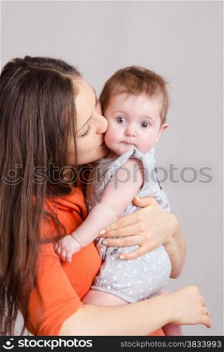 Portrait of mother and baby at the hands of six mothers