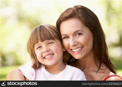 Portrait Of Mother And Child Relaxing In Park
