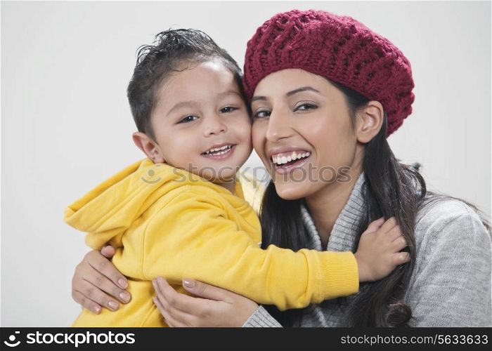 Portrait of mother and son embracing