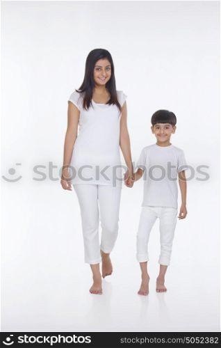 Portrait of mother and son holding hands