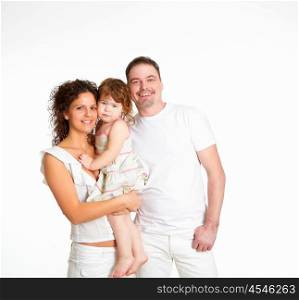 portrait of mother, father and their child together in studio