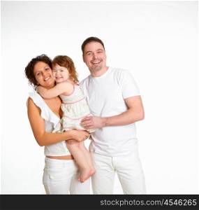 portrait of mother, father and their child together in studio