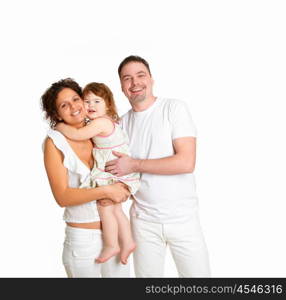 portrait of mother, father and their child together in studio