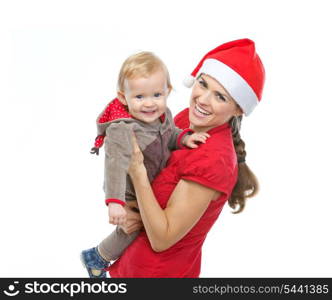 Portrait of mother in Santa&rsquo;s hat playing with baby