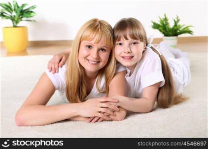 portrait of mother together with daughter in studio