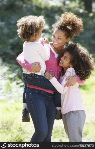 Portrait Of Mother With Daughters In Countryside